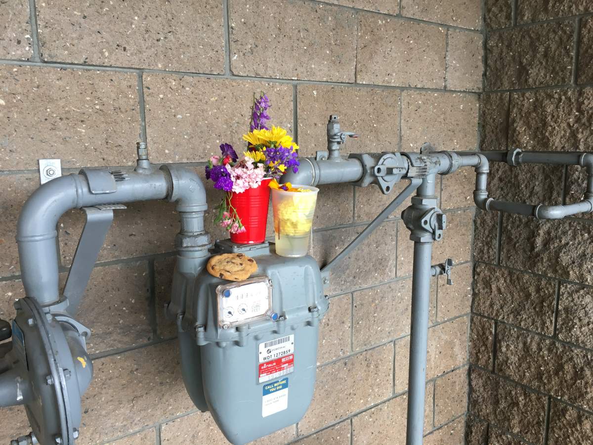 A small flower memorial marks the spot where Eli Beauregard was stabbed on June 27.