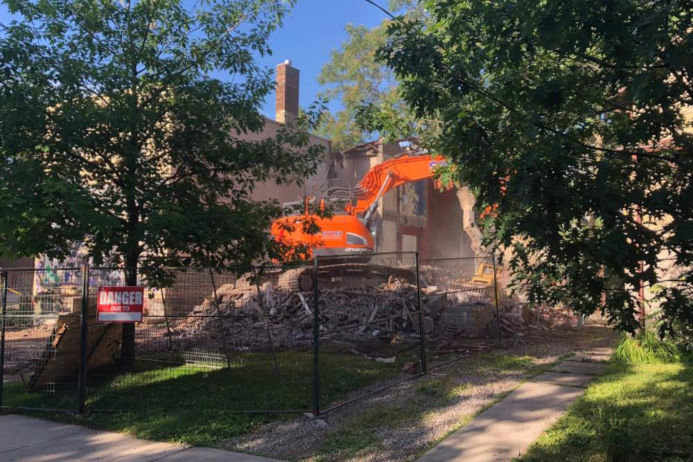 The house next to the store was first to be torn down.