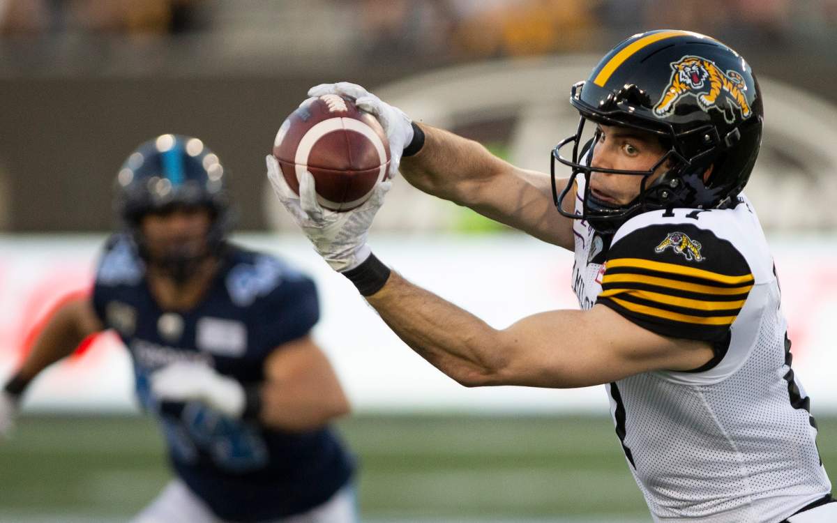 Hamilton Tiger-Cats' Luke Tasker makes a catch during first-half CFL pre-season football game action against the Toronto Argonauts in Hamilton on Thursday, June 6, 2019.