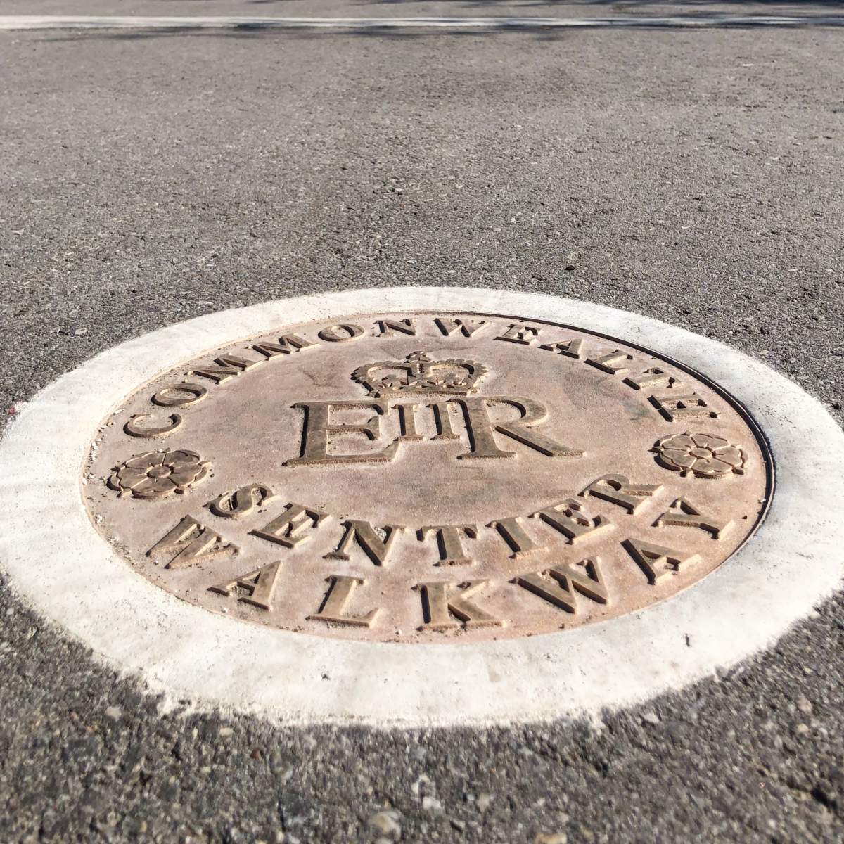 An example of the medallion along the Edmonton Commonwealth Walkway.