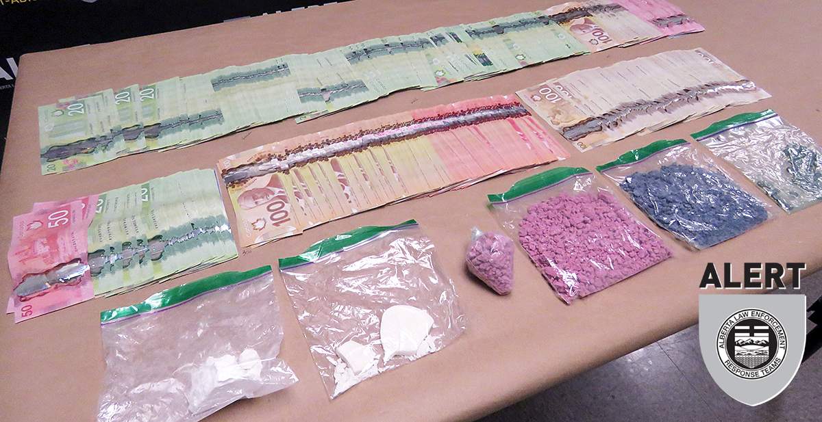 Drugs and cash seized during two searches in southern Alberta on Aug. 8, 2019. 