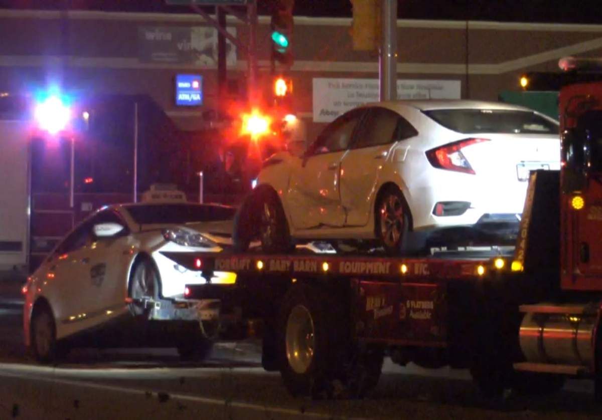 Vehicles are towed away from the scene of a three-vehicle crash at the intersection of Main Street and Vaughan Harvey Boulevard in Moncton, N.B., on Aug. 25, 2019.