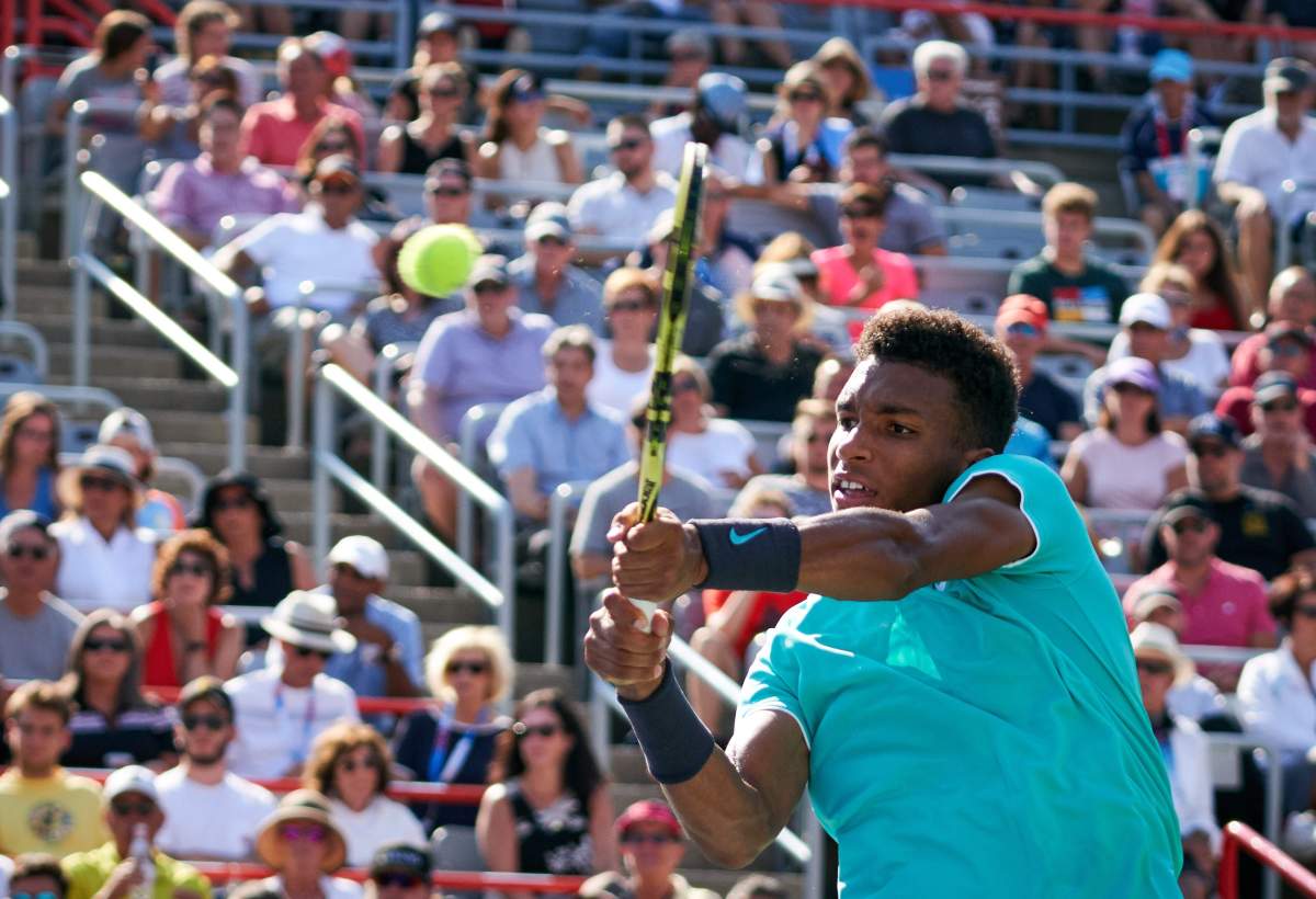 Félix Auger-Aliassime of Canada in action against Karen Khachanov of Russia during their round of 16 match at the Rogers Cup in Montreal, Canada, 08 August 2019. 