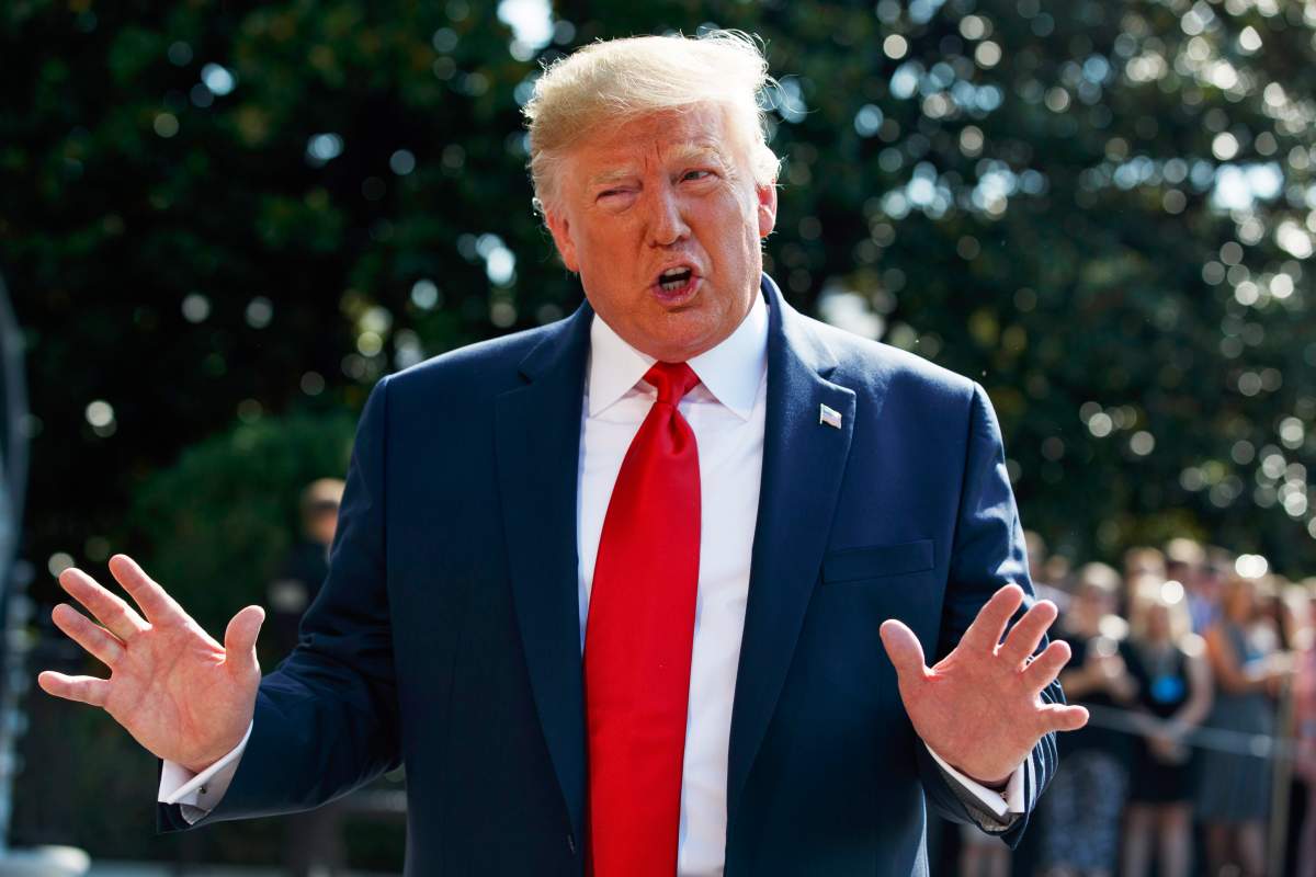 U.S. President Donald Trump talks to reporters on the South Lawn of the White House, Friday, Aug. 9, 2019, in Washington.