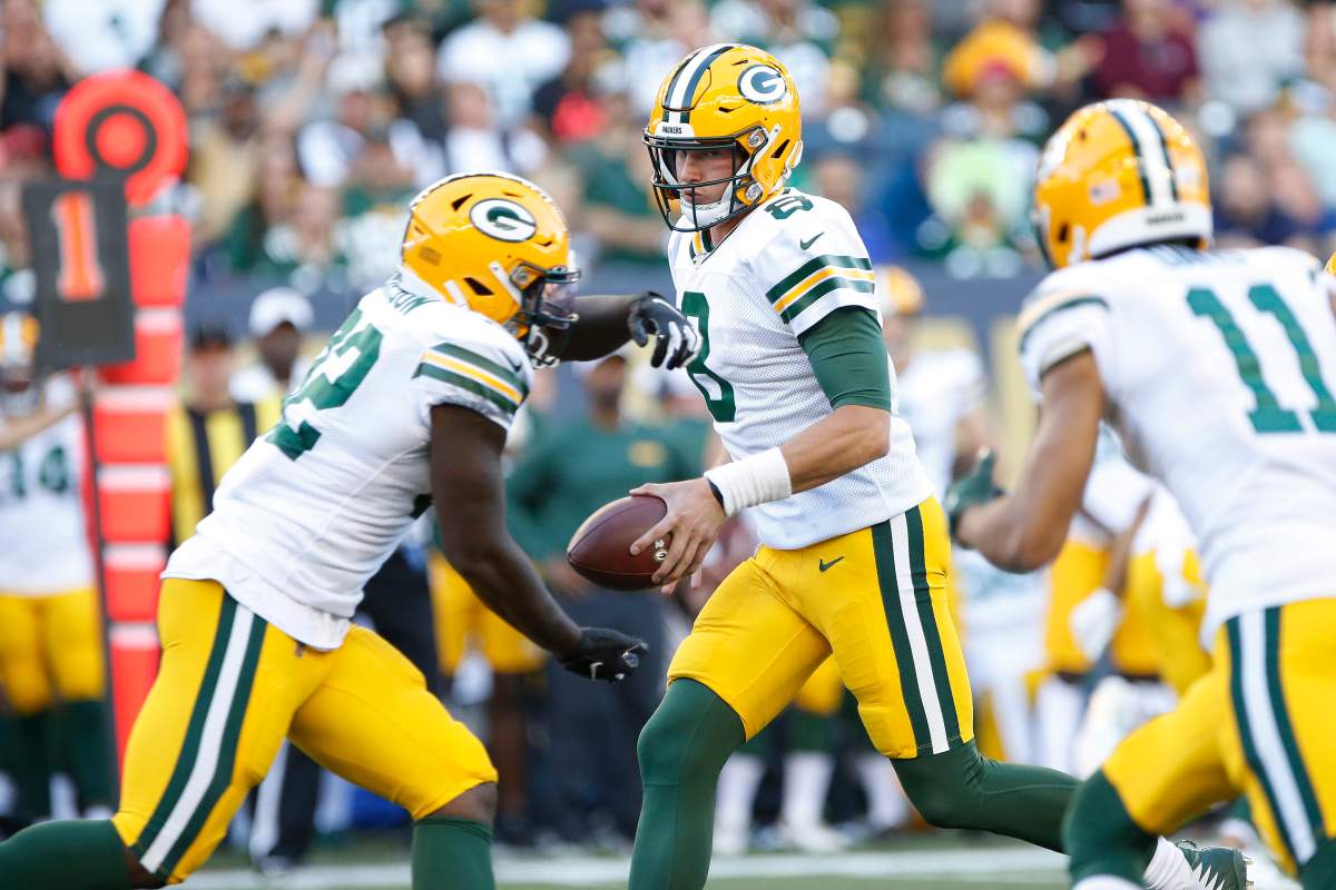 Green Bay Packers quarterback Tim Boyle (8) hands off to running back Tra Carson (32) during the first half of NFL pre-season action against the Oakland Raiders in Winnipeg Thursday, August 22, 2019.