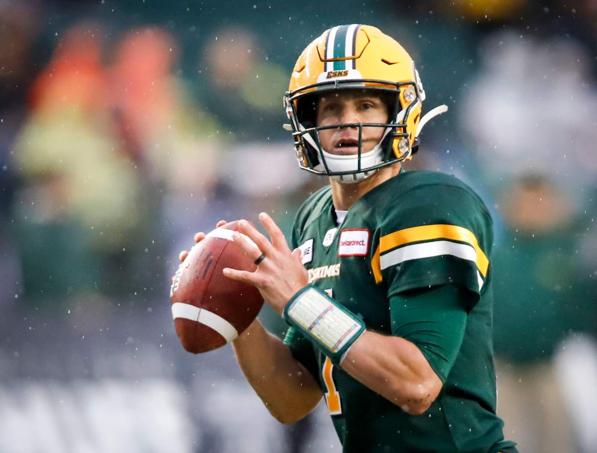 Edmonton Eskimos quarterback Trevor Harris looks for a receiver during first half CFL football action against the Winnipeg Blue Bombers in Edmonton, Friday, Aug. 23, 2019.