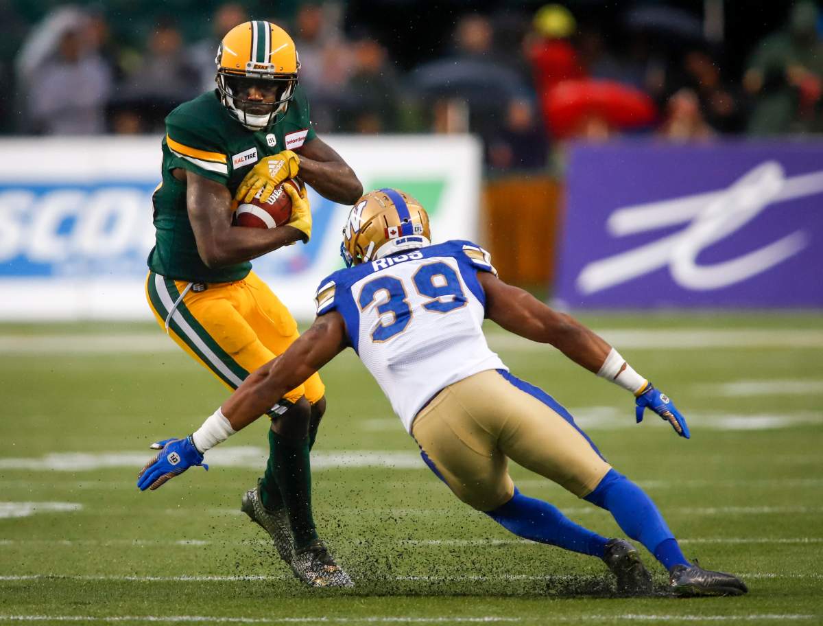 Winnipeg Blue Bombers' Marcus Rios, left, closes in on Edmonton Eskimos' DaVaris Daniels during first half CFL football action in Edmonton, Friday, Aug. 23, 2019.