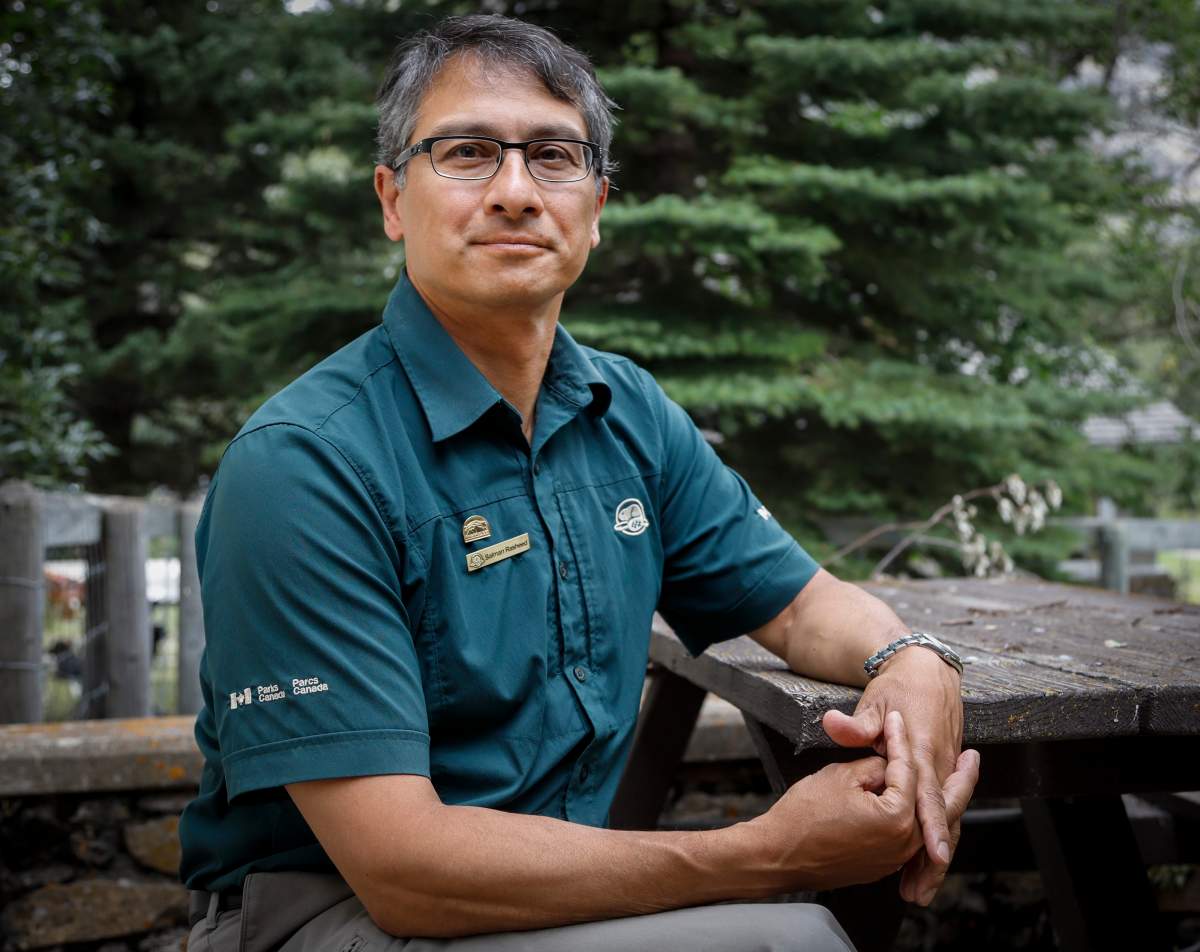 Waterton Park warden Salman Rasheed sees new life for the park after a wildfire two years ago in Waterton National Park, Alta., Friday, Aug. 9, 2019.