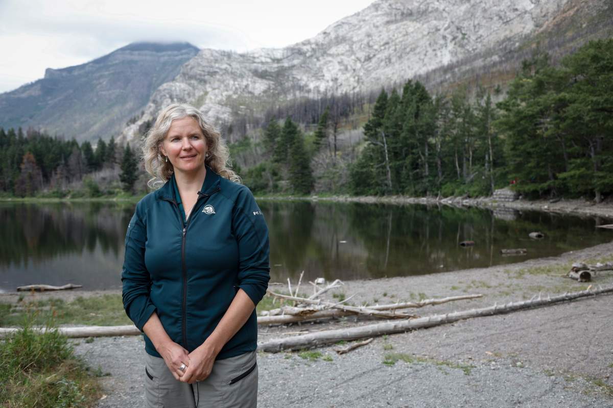 Kim Pearson, an ecosystem scientist with Parks Canada, speaks about the park’s re-growth after a wildfire two years ago in Waterton National Park, Alta., Friday, Aug. 9, 2019.