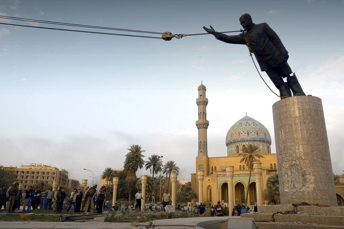A statue of former Iraqi dictator Saddam Hussein is toppled in central Baghdad at the conclusion of U.S.-led Operation Iraqi Freedom, April 9, 2003.