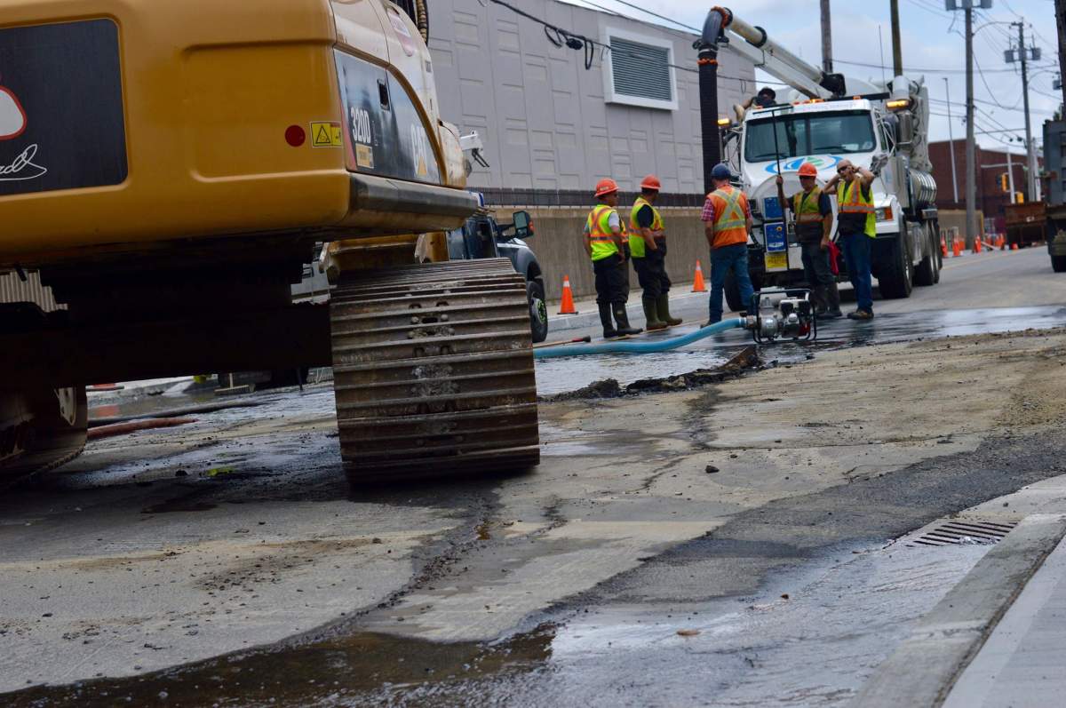 Crews examine the water main break on Gottingen Street on Aug. 22, 2019.
