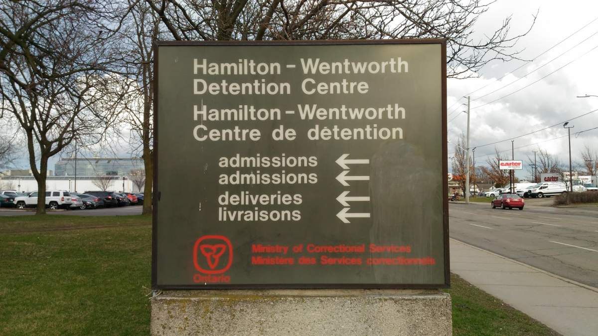 Two correctional officers charged and arrested by Hamilton Police.