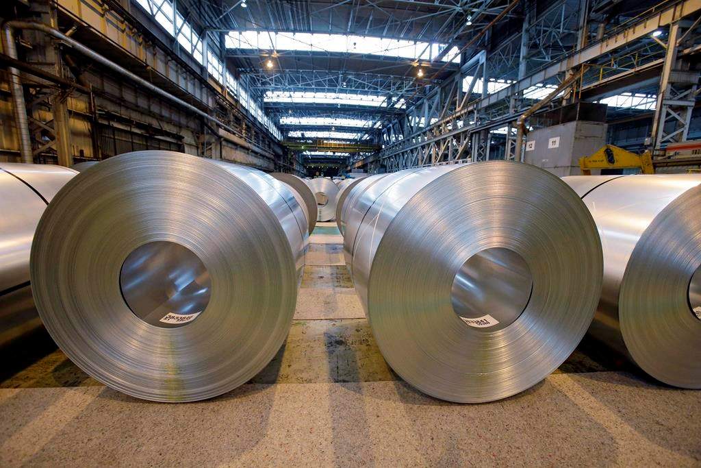 In this Feb. 15, 2013, file photo, finished galvanized steel coils await shipment at ArcelorMittal Steel's hot dip galvanizing line in Cuyahoga Heights, Ohio.