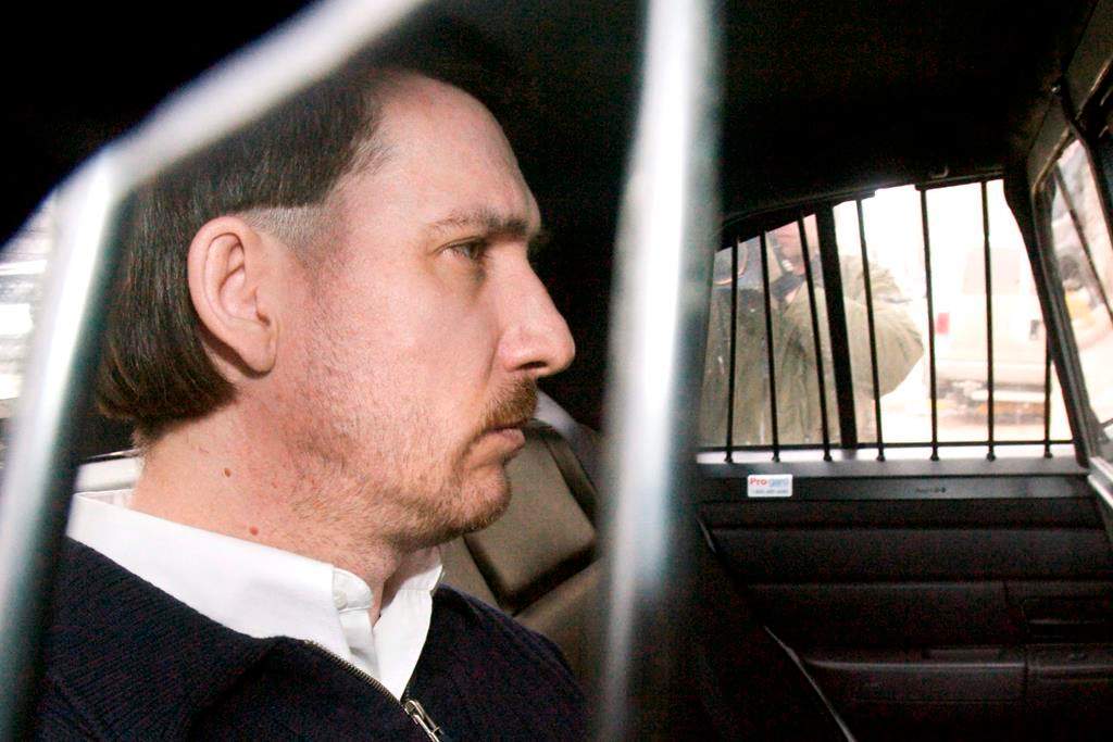 Convicted murderer Curtis Dagenais is escorted from court following sentencing in his murder trial Friday, March 13, 2009, in Saskatoon, Sask. For a Saskatchewan woman who discovered a fugitive Mountie killer hiding in her family's hayfield more than a decade ago, the intense search for two young murder suspects in northern Manitoba stirs old memories.