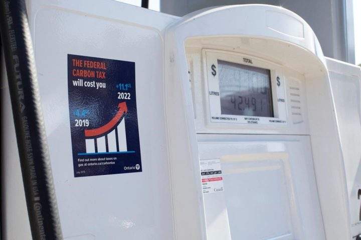 A gas pump displays an anti-carbon tax sticker in Toronto on Thursday, Aug. 29, 2019. A law required gas station owners across Ontario to post anti-carbon price stickers on their pumps. THE CANADIAN PRESS/Chris Young