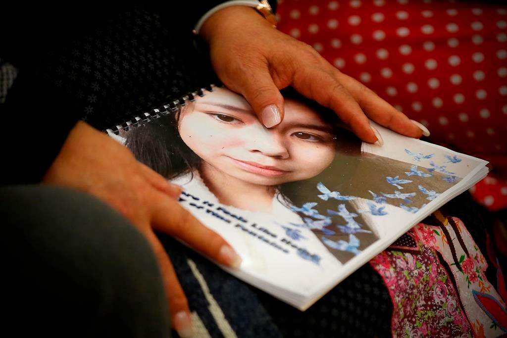 Sagkeeng Coun. Marilyn Courchene holds a report by Daphne Penrose, the Manitoba advocate for children and youth, focusing on the death of 15-year-old Tina Fontaine at a release event at the Sagkeeng Mino Pimatiziwin Family Treatment Centre on the Sagkeeng First Nation, Man., Tuesday, March 12, 2019.