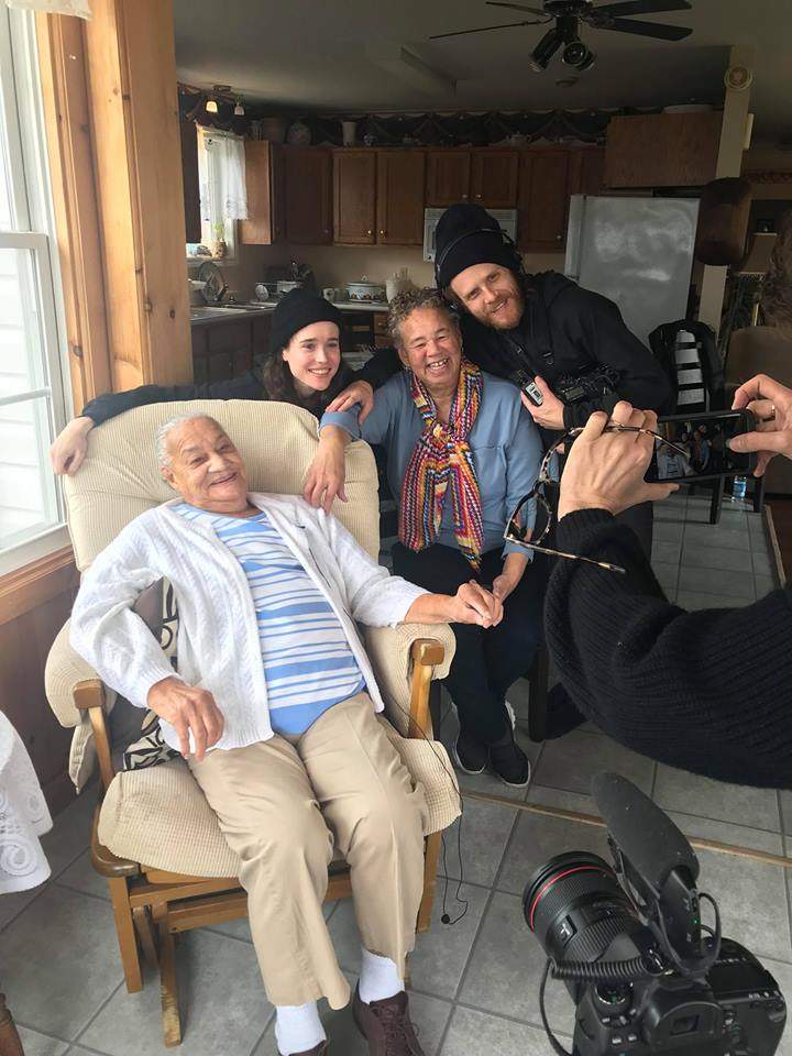 Louise Delisle from Shelburne in the blue shirt and scarf with Ellen Page, alongside crew and family members.