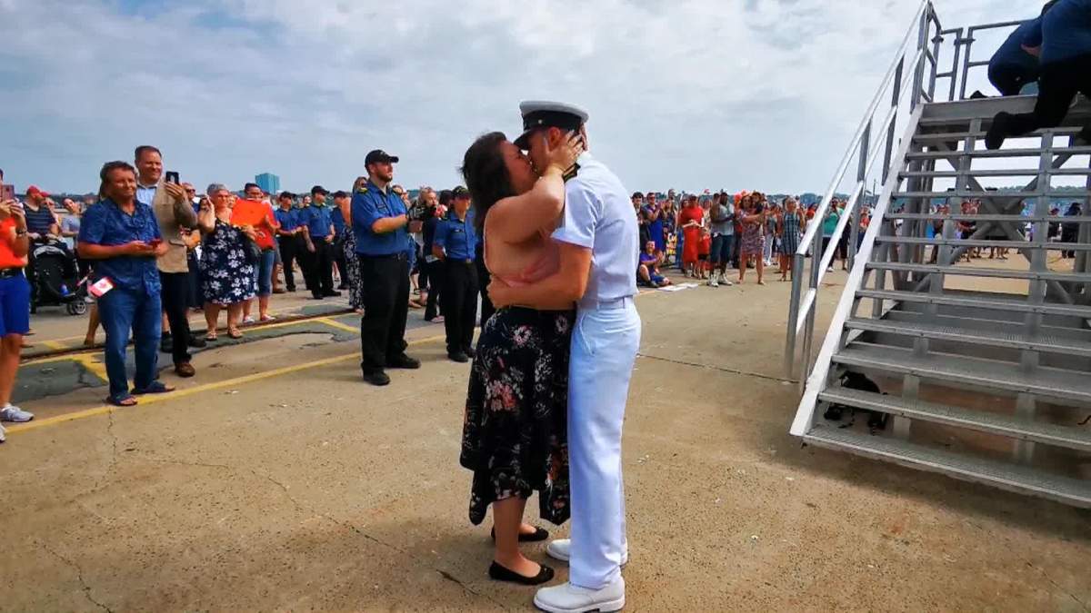 After six-months overseas, Leading Seaman Nathan Durette embraces his partner Alexandra Levesque as he disembarks HMCS Toronto.