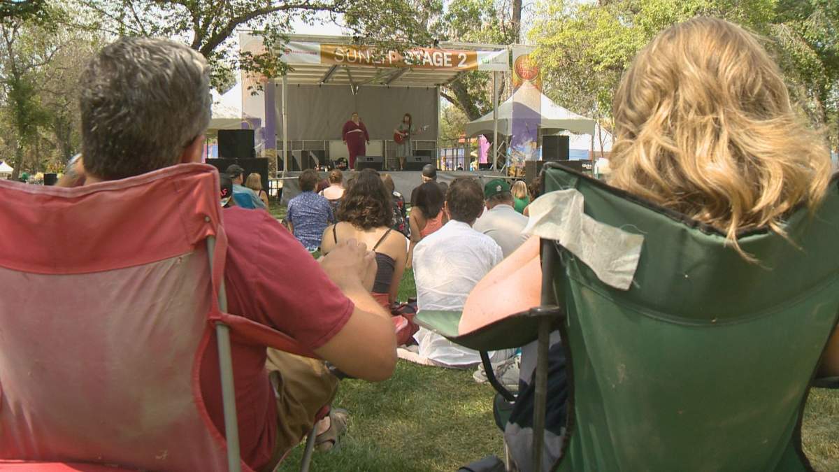 Regina Folk Fest attendees watch Megan and Jenna Nash perform on Friday afternoon. 
