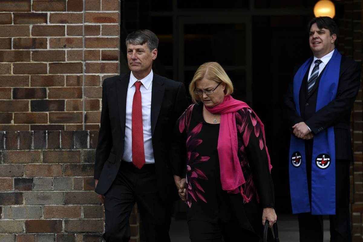 Stephen (L) and Shaunagh Fowler (C), the parents of Australian murder victim Lucas Fowler, 23, who was found shot to death with his American girlfriend Chynna Deese alongside a highway in Canada’s northern British Columbia two weeks ago, leave the Turramurra Uniting Church after a memorial service in Sydney on August 2, 2019. (SAEED KHAN/AFP/Getty Images)
