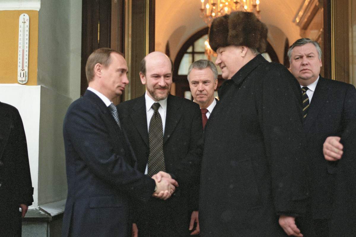Moscow, Russia, outgoing Russian president Boris Yeltsin (r) shaking hands with Russian prime minister and acting president Vladimir Putin (l) as he leaves Moscow’s Kremlin, the seat of Russian power,1999.