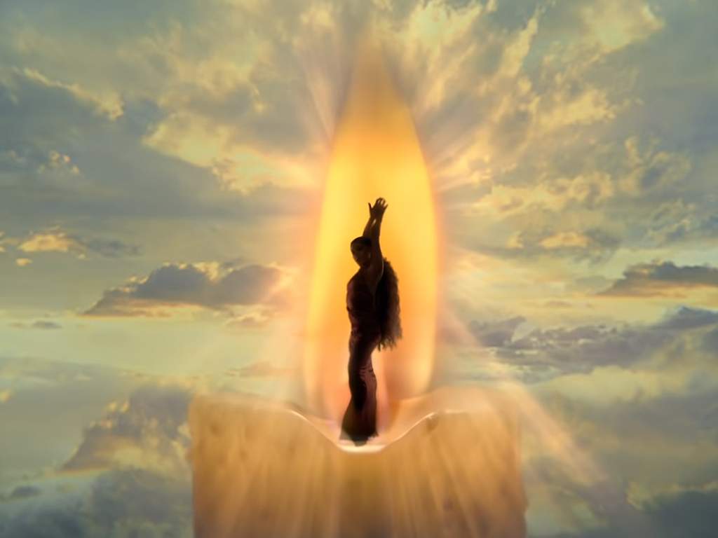 A still capture from Ariana Grande’s ‘God is a Woman’ music video. She was sued by artist Vladimir Kush for using the likeness of his painting, ‘Candle’ in this shot.