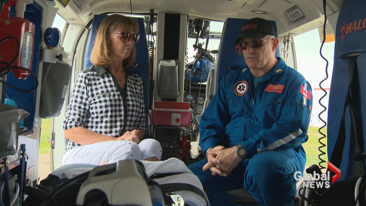 Betty Schaufele and Steve Harmer sit inside a HALO Air Ambulance in Medicine Hat, Alta.