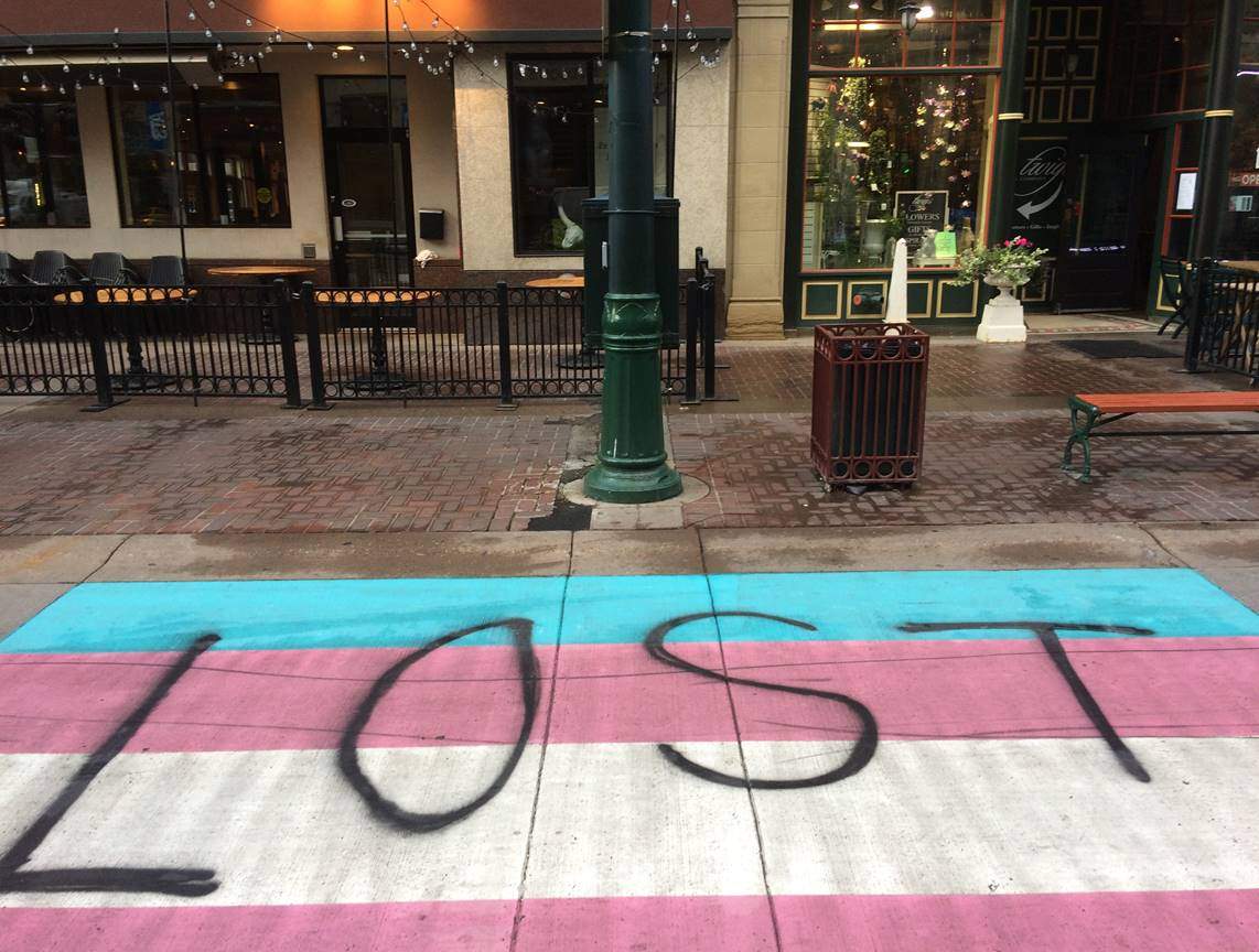 A vandalized Trans Pride crosswalk is seen in downtown Calgary.