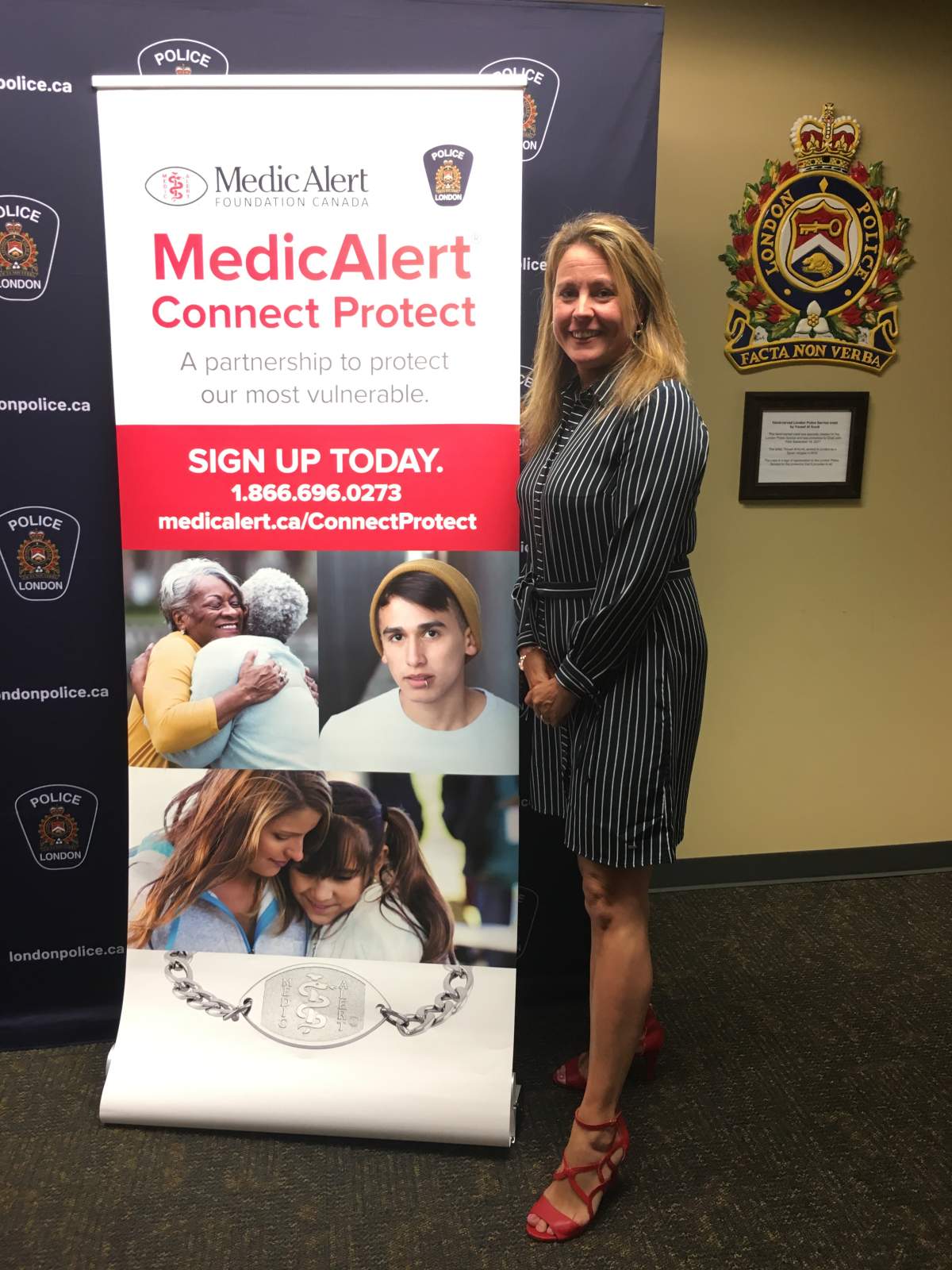 Horlock poses with the MedicAlert banner. MedicAlert and London police are now partners