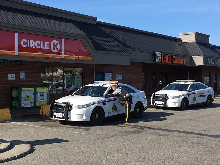 Two police cars can be seen outside the Circle K convenience store along KLO and Gordon Drive on Tuesday morning.