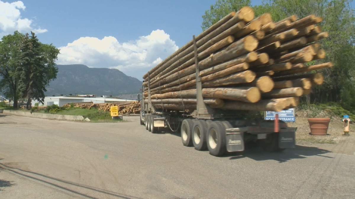 Logs are hauled into the Tolko mill in Kelowna.