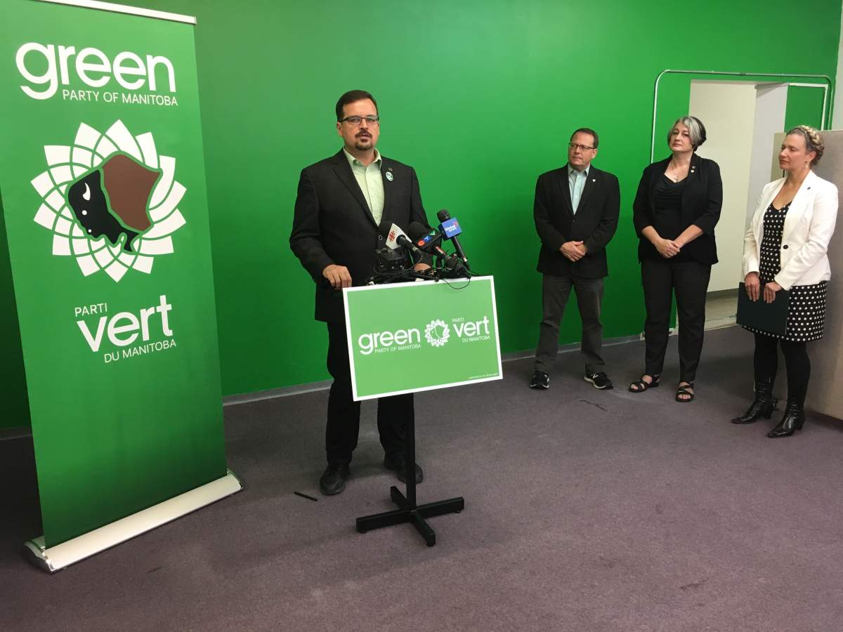 Green Party Wolseley Candidate David Nickarz speaks about proportional representation, flanked by other Green Party officials. Michael Draven/Global News.