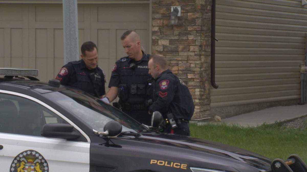 Calgary police on the scene of a break and enter where an officer was bitten by a police dog on Friday, Aug. 16.