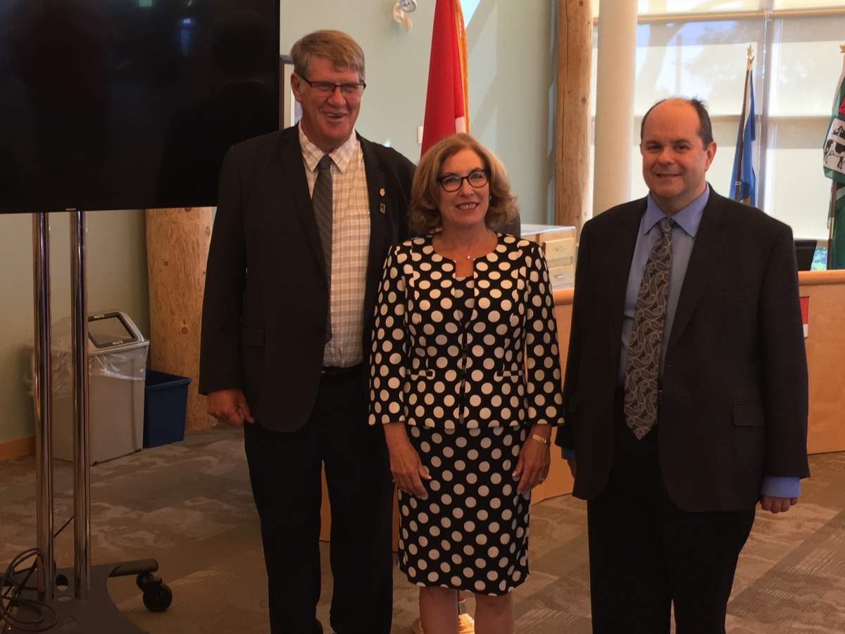 Alwnick-Haldiman Township Warden John Logel, left, Northumberand-Peterborough South MP Kim Rudd and Clayton Zekelman, president of Nexicom, gather for a funding announcement to expand services in the riding.