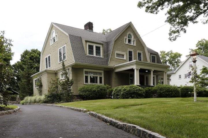 In this June 25, 2015, file photo, a newspaper rests on the driveway of the home of Derek and Maria Broaddus in Westfield, N.J.