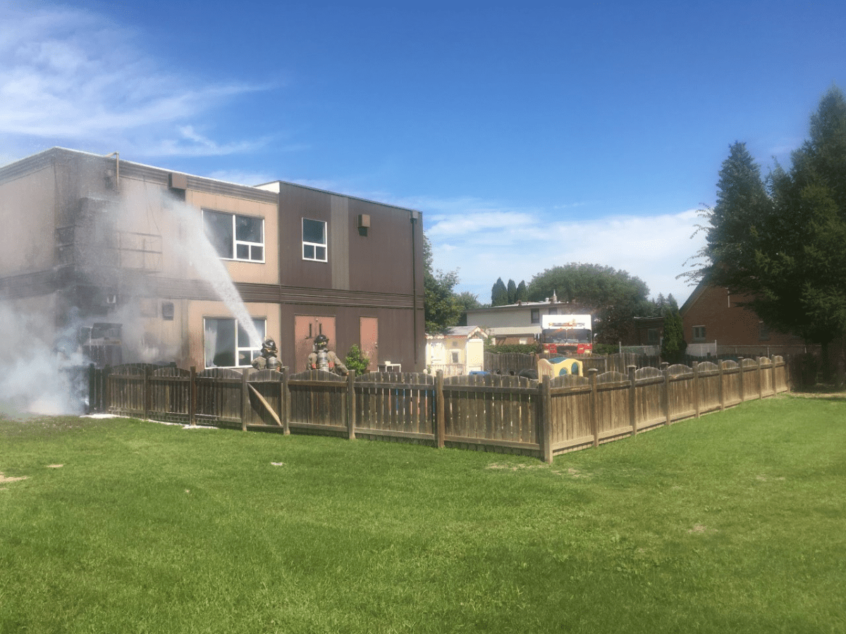 Saskatoon firefighters said flames were coming from the corner of the building and a fence at the St. Francis School daycare when they arrived.