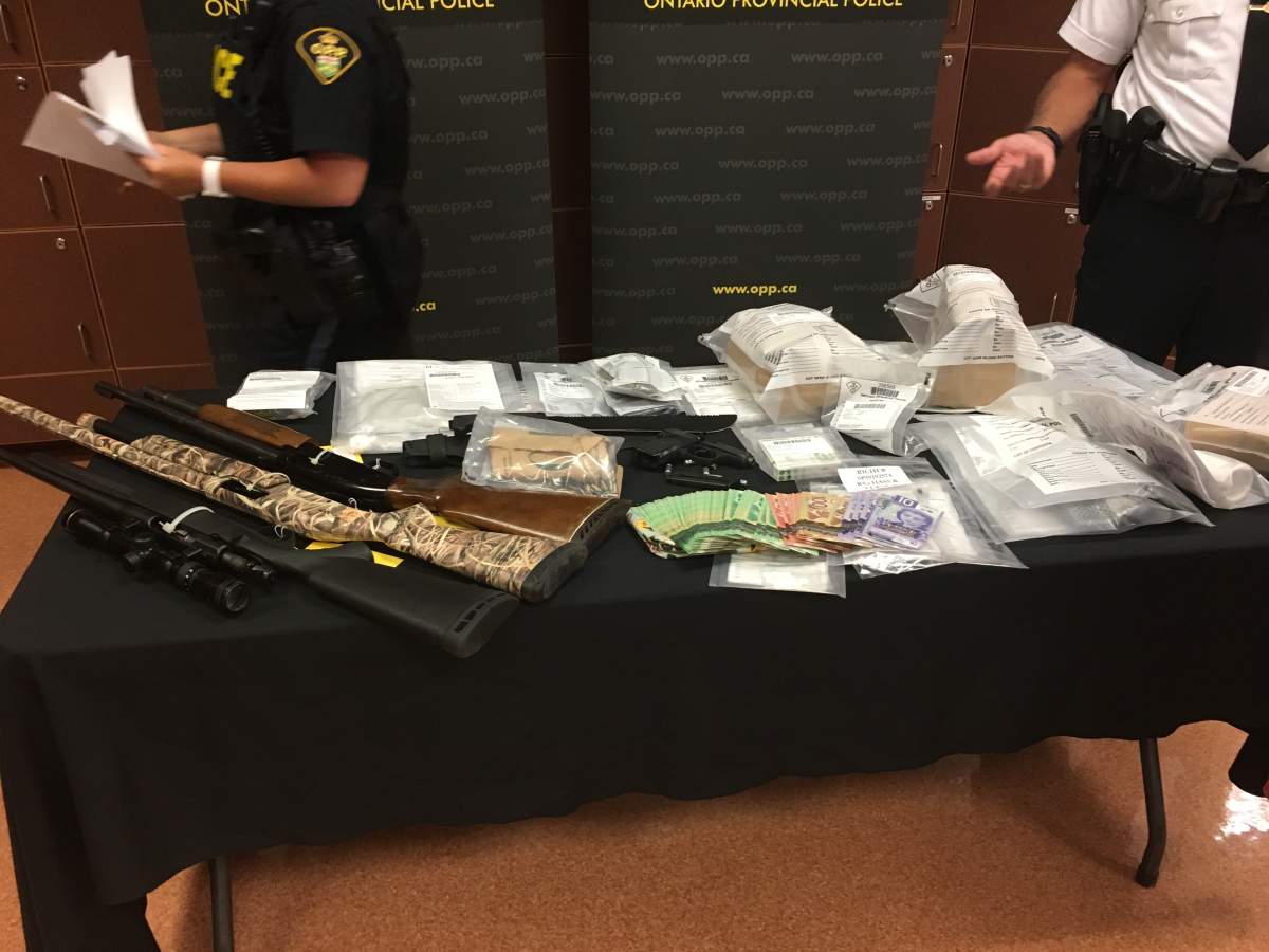 Lennox and Addington OPP say they seized cash, guns and drugs from the apartment of the couple allegedly responsible for a stabbing in Amherstview last week.