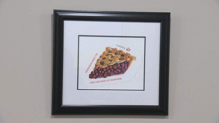 Framed Saskatoon berry pie stamp hangs in the mayor’s office.