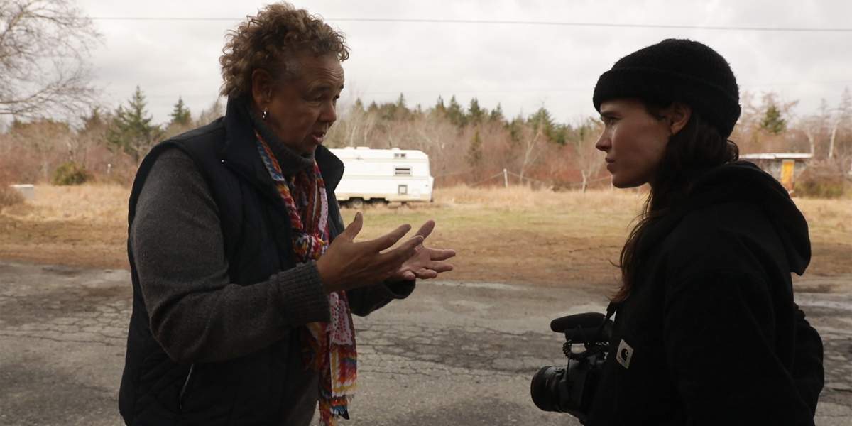 Louise Delisle speaking to Ellen Page about the impact of environmental racism on her community in Shelburne, N.S. 
