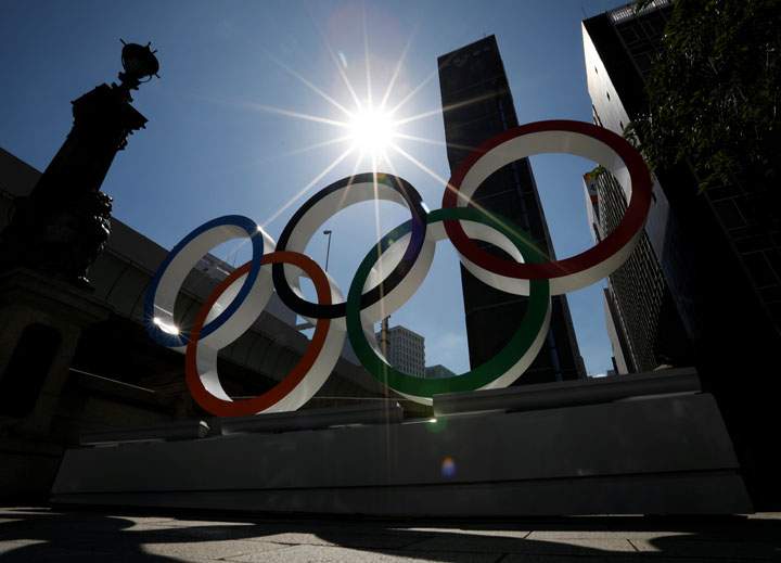 Summer sunshine is seen through Olympic rings displayed at Nihonbashi district in Tokyo, Japan August 5, 2019.