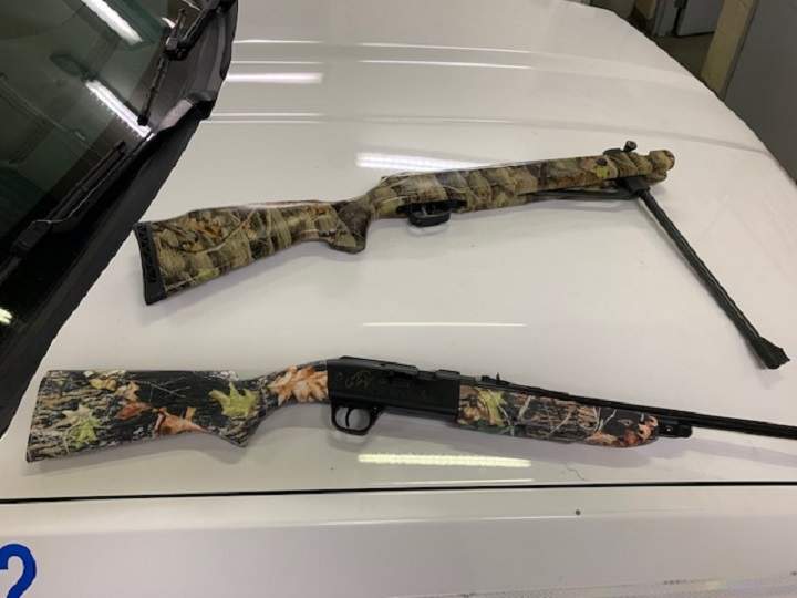 The two mountain bikes are Giant and Trek models, while the two pellet guns have camouflage stocks.