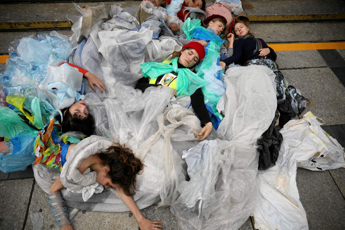 Young activists stage a performance during the Global Climate Strike in Warsaw, Poland (Maciek Jazwiecki/Agencja Gazeta/REUTERS)
