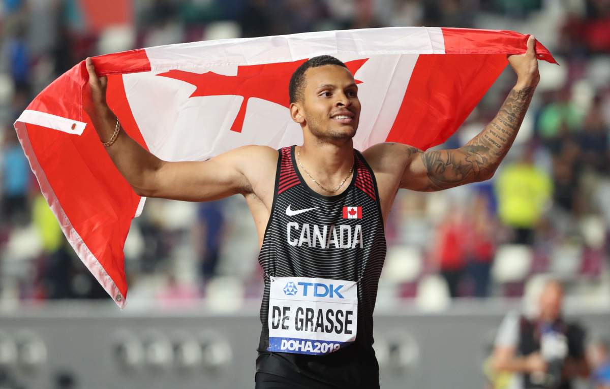 Canada's Andre De Grasse celebrates winning bronze in the final men's 100 metres event at Khalifa International Stadium in Doha, Qatar, on September 28, 2019 .