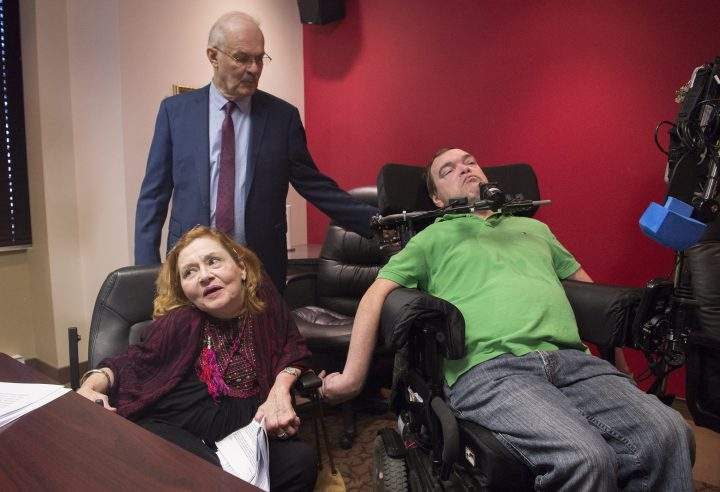 Nicole Gladu, left, and Jean Truchon, right, attend a news conference with lawyer Jean-Pierre Menard in Montreal, Thursday, Sept. 12, 2019.