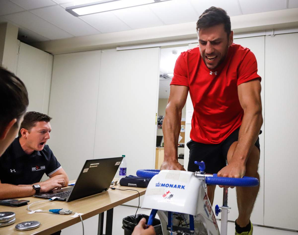Calgary Flames’ Milan Lucic rides an exercise bike at the Flames main camp testing day in Calgary, Thursday, Sept. 12, 2019.