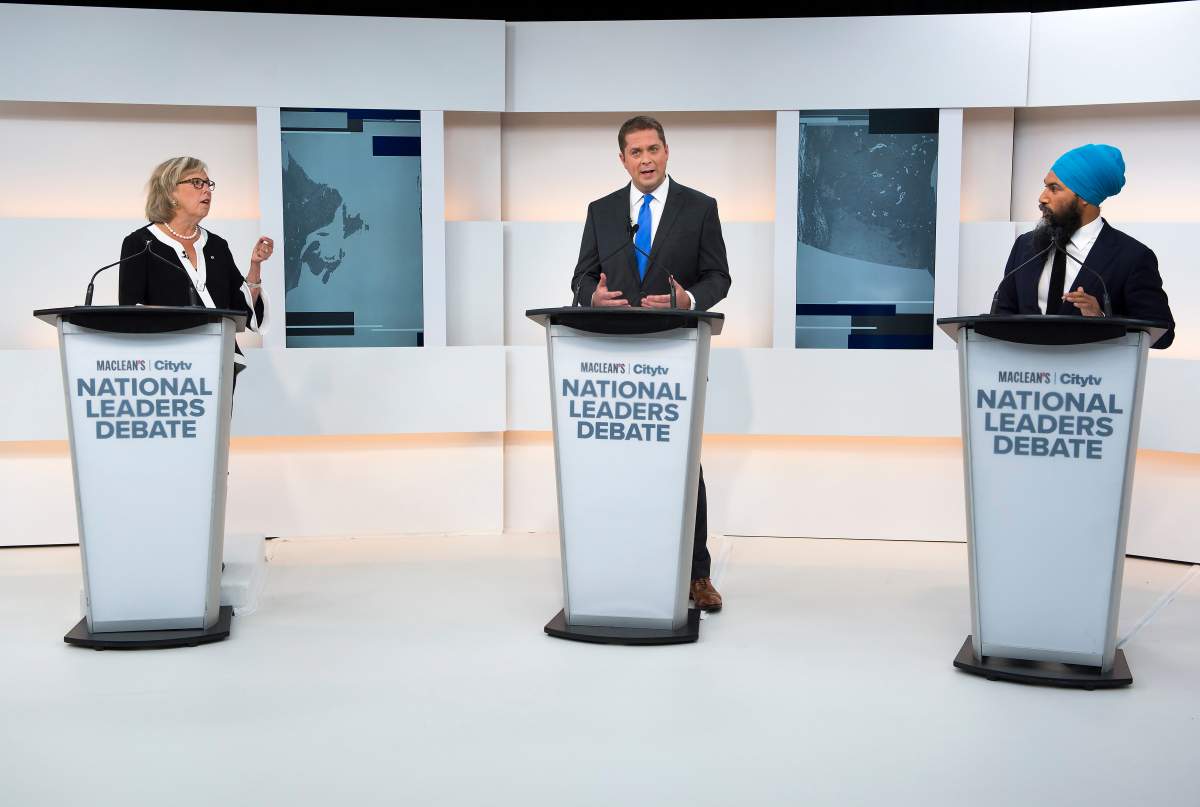 Green Party Leader Elizabeth May, left, Conservative Leader Andrew Scheer, centre, and NDP Leader Jagmeet Singh take part during the Maclean's/Citytv National Leaders Debate in Toronto on Thursday, Sept. 12, 2019. 