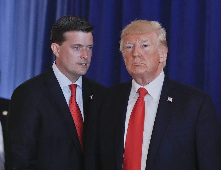 In this Aug. 12, 2017, photo, Rob Porter, left, White House Staff Secretary, speaks to President Donald Trump after Trump made remarks regarding the ongoing situation in Charlottesville, Va., at Trump National Golf Club in Bedminister, N.J. 