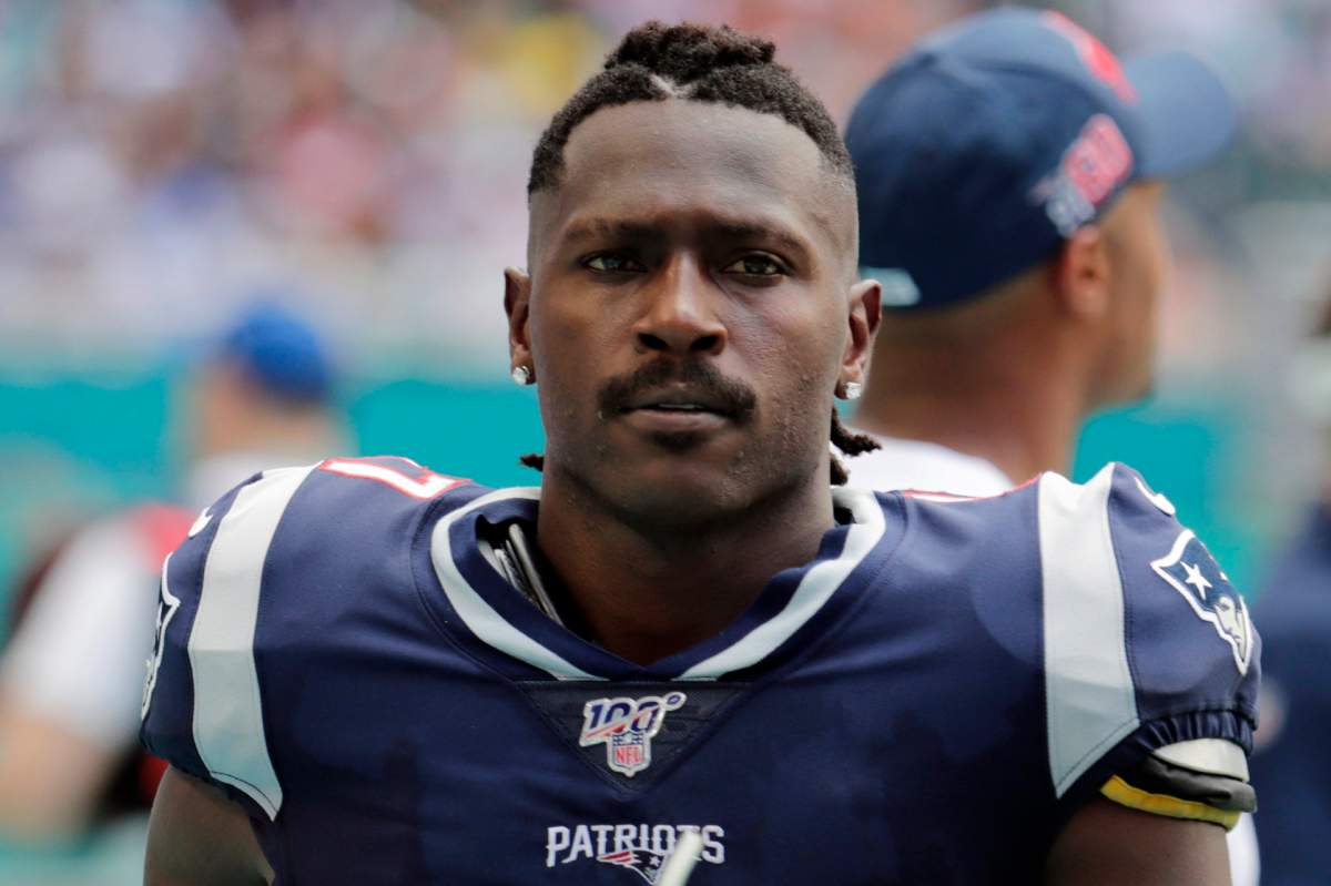 FILE - In this Sunday, Sept. 15, 2019, file photo, New England Patriots wide receiver Antonio Brown (17) on the sidelines, during the first half at an NFL football game against the Miami Dolphins in Miami Gardens, Fla.