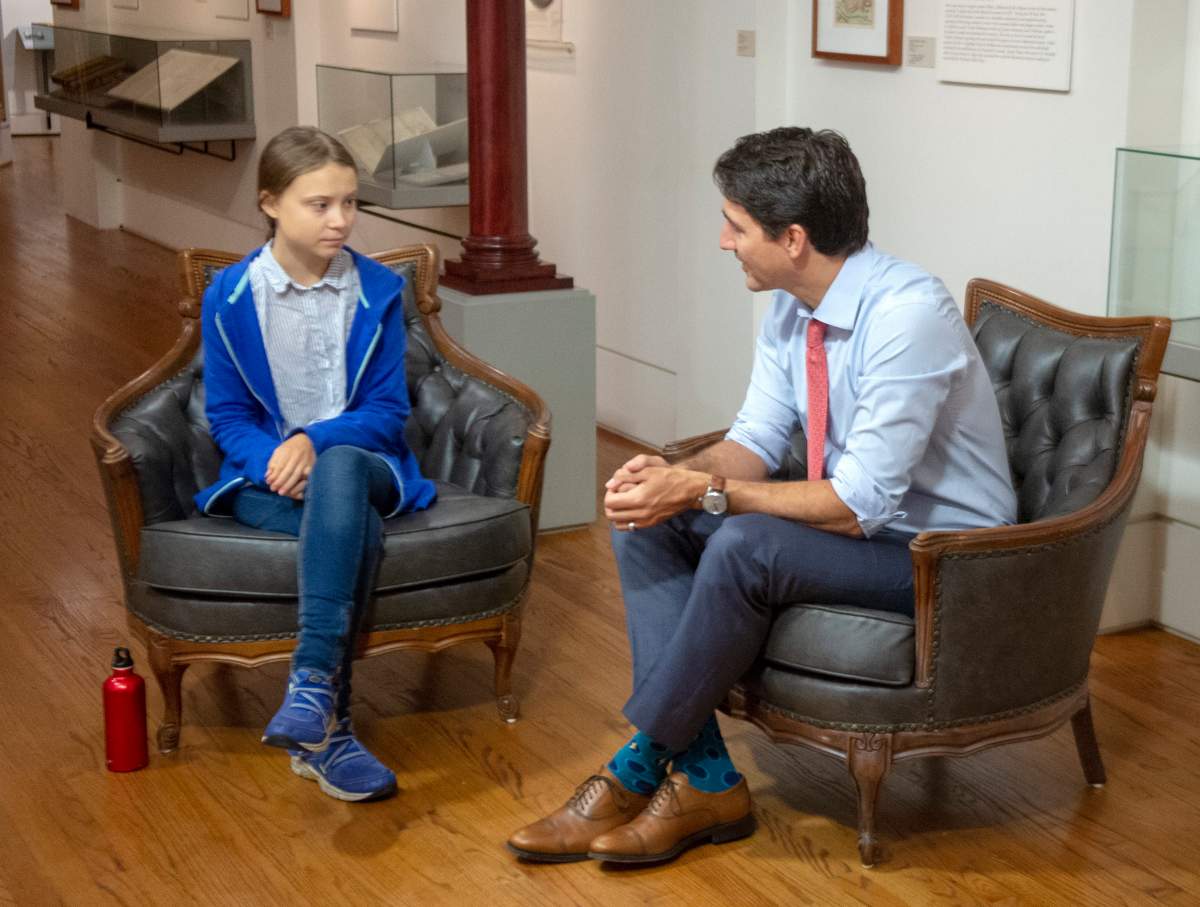 Canadian Prime Minister and Liberal Leader Justin Trudeau speaks with Swedish environmental activist Greta Thunberg in Montreal on Friday, Sept. 27, 2019. THE CANADIAN PRESS/Ryan Remiorz