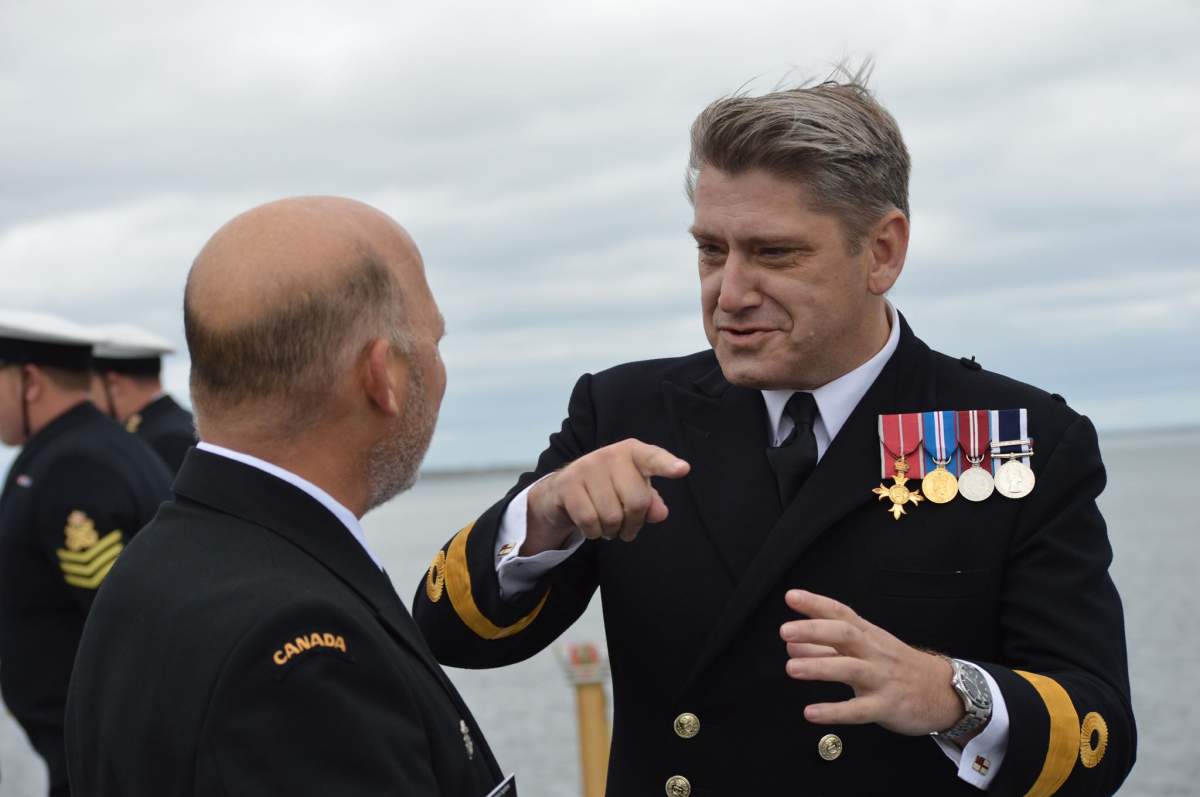 Rear Admiral Craig Baines, Commander of the Maritime Forces Atlantic, speaks with Commodore Mike Utley, commander of HMS Queen Elizabeth’s carrier strike group.